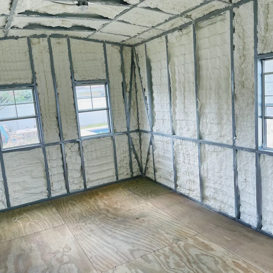 Closed-cell spray foam insulation applied to wall cavities in a residential project in Athens